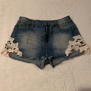 2 Jean shorts w/white side decorations